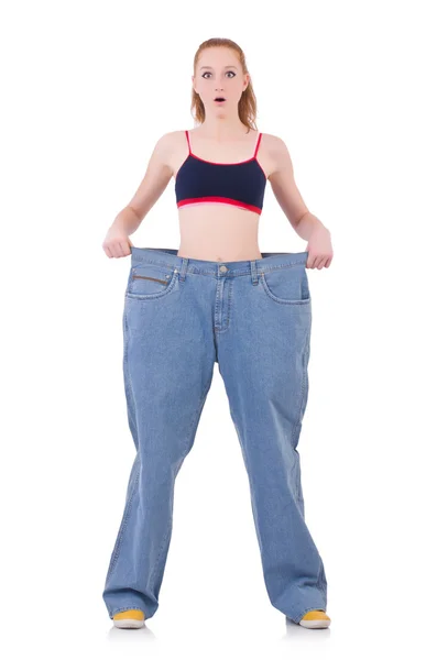 Woman with large jeans — Stock Photo, Image