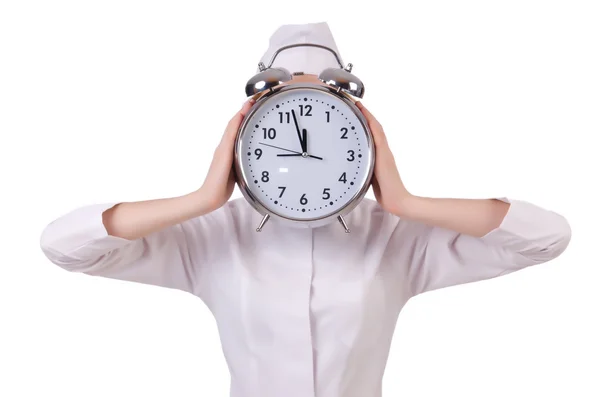 Attractive woman doctor with big clock  isolated on white — Stock Photo, Image