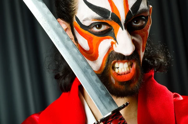 Man with sword and face mask — Stock Photo, Image