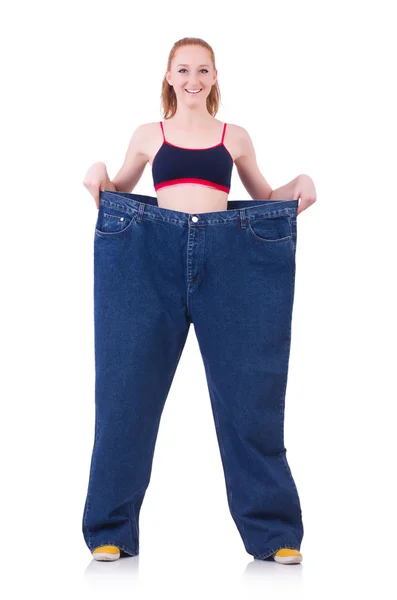 Woman with large jeans — Stock Photo, Image