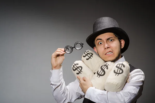Egy férfi egy zsák pénzzel. — Stock Fotó