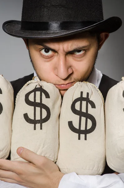 Man with sacks of money — Stock Photo, Image