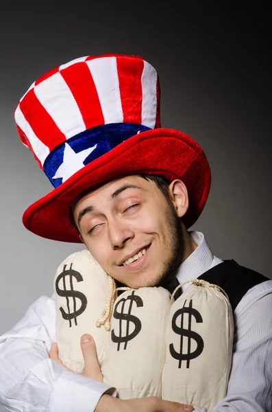 Hombre con sacos de dinero — Foto de Stock