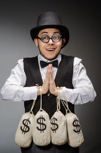 Mann mit Säcken voller Geld — Stockfoto