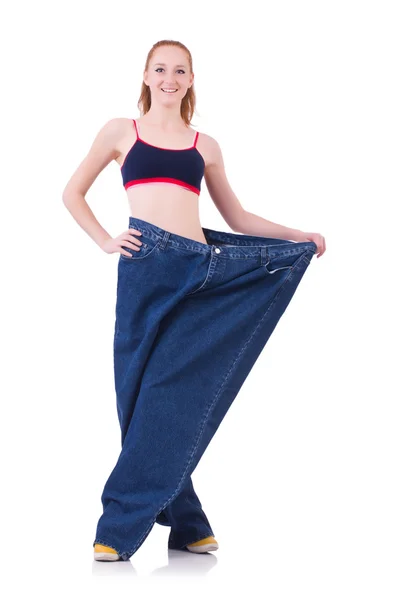 Woman with large jeans — Stock Photo, Image
