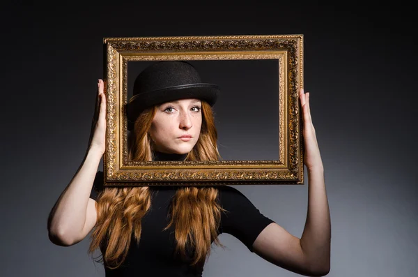 Girl with picture frame — Stock Photo, Image