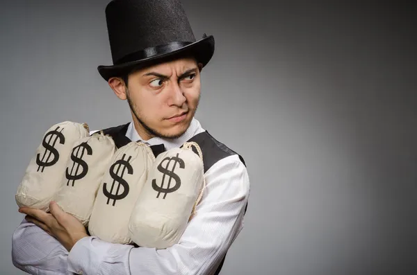 Man with sacks of money — Stock Photo, Image