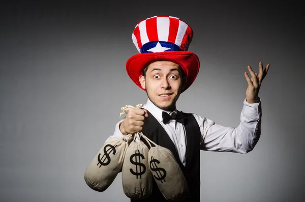 Man with sacks of money — Stock Photo, Image