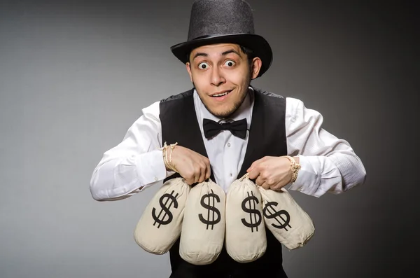 Man with sacks of money — Stock Photo, Image