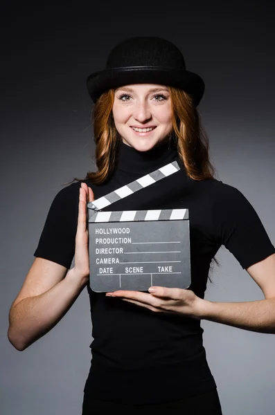 Girl in hat with movie board — Stock Photo, Image