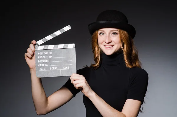 Girl in hat with movie board — Stock Photo, Image