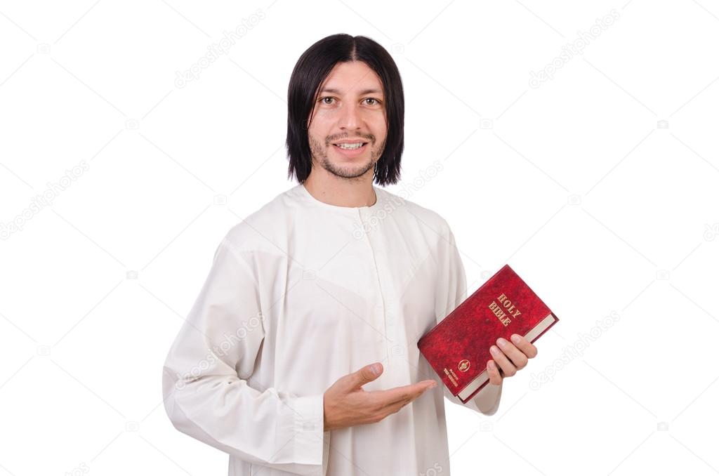 Young priest with bible