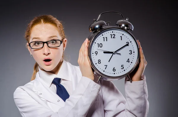 Woman doctor missing her deadlines — Stock Photo, Image