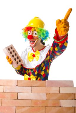 Clown laying bricks clipart
