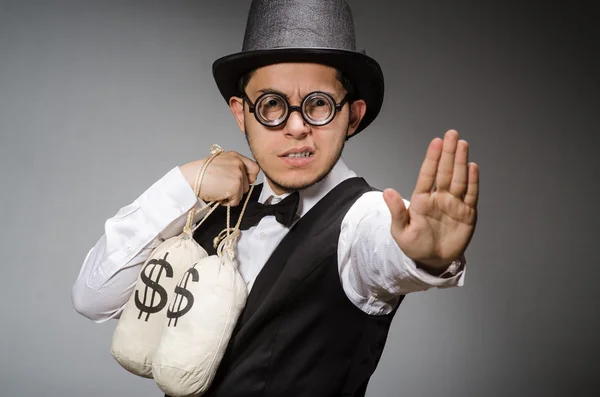 Mann mit Säcken voller Geld — Stockfoto