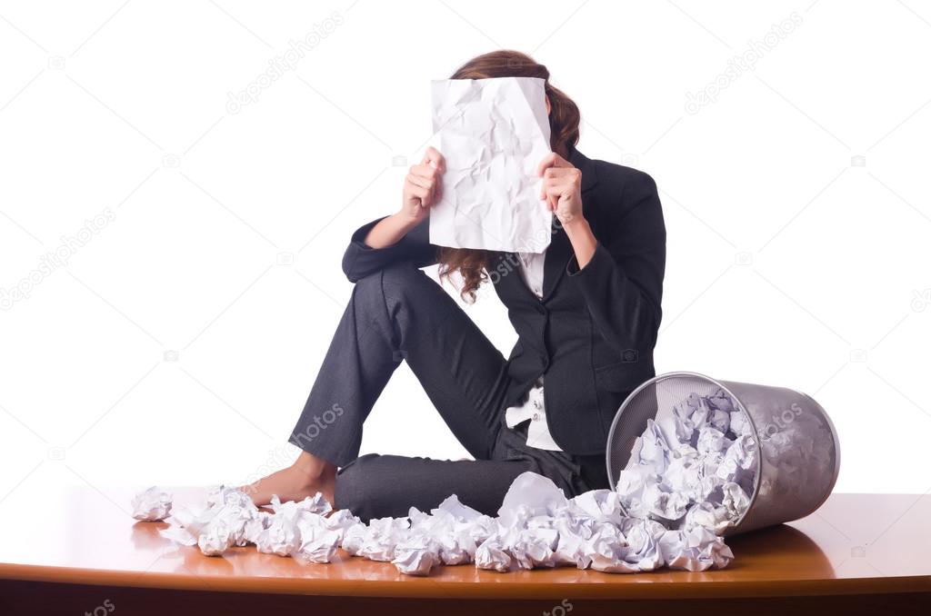 Woman with lots of discarded paper