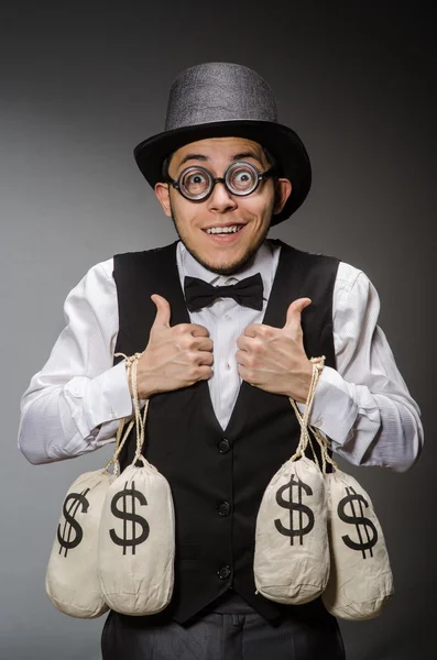 Man with sacks of money — Stock Photo, Image