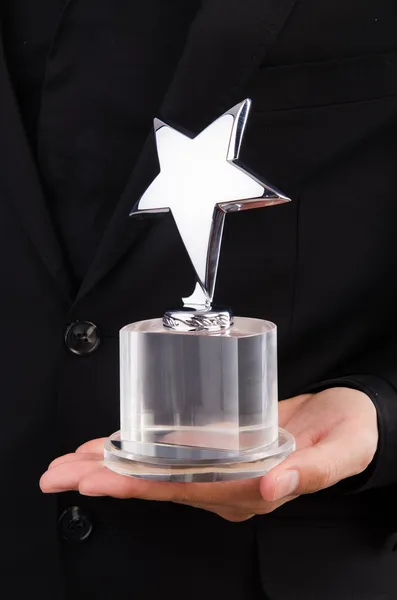 Empresario con premio estrella — Foto de Stock