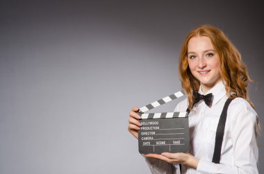 Woman with movie board clipart