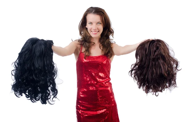 Mulher com uma seleção de peruca — Fotografia de Stock