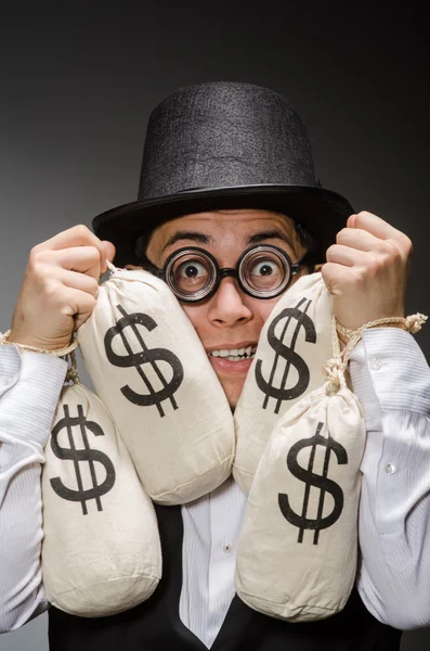 Mann mit Säcken voller Geld — Stockfoto