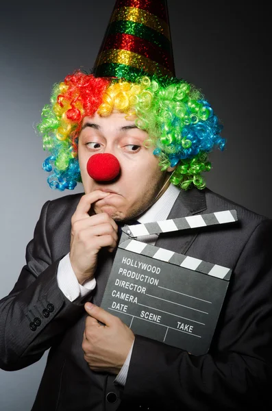 Clown with the movie board — Stock Photo, Image