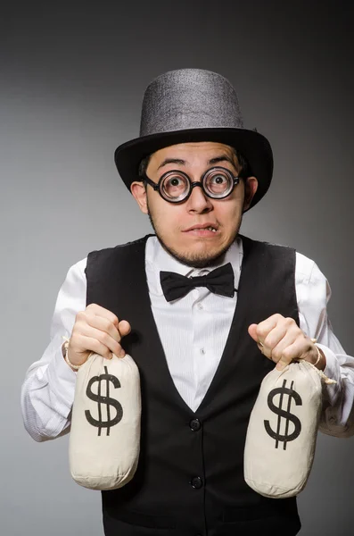 Man with sacks of money — Stock Photo, Image