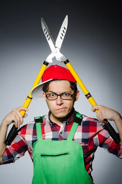 Man with giant shears — Stock Photo, Image