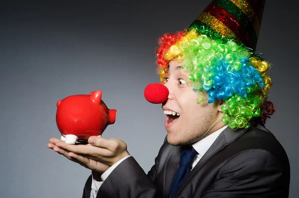 Clown med piggybank — Stockfoto