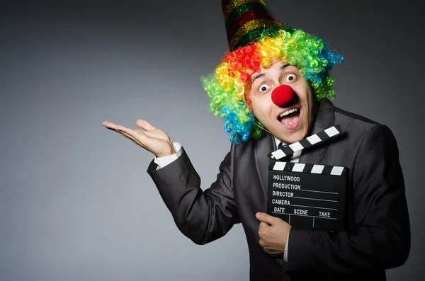 Clown with the movie board — Stock Photo, Image