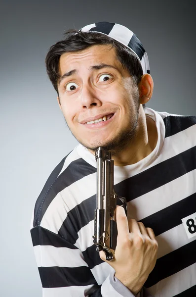 Prisoner with gun — Stock Photo, Image