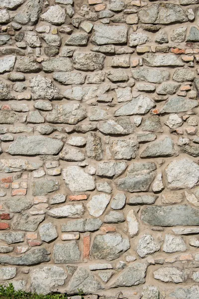 Mur fait de diverses pierres — Photo