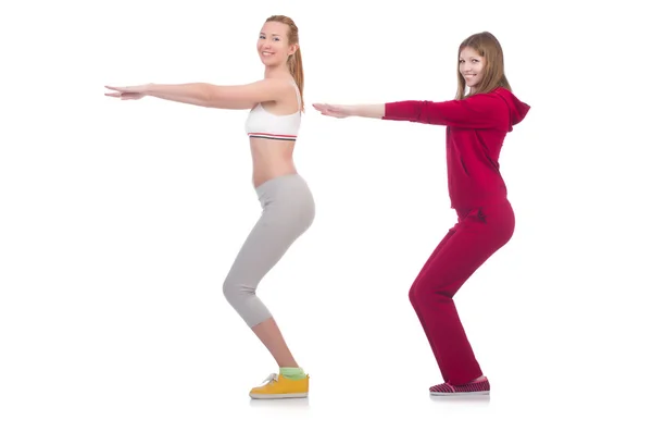 Pair of women doing exercises on white — Stock Photo, Image