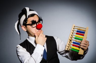 Funny clown with abacus clipart