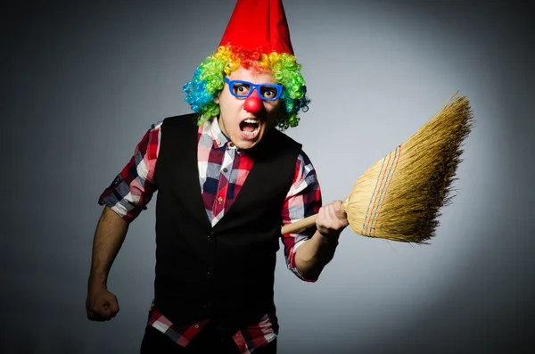 Funny clown with the broom — Stock Photo, Image