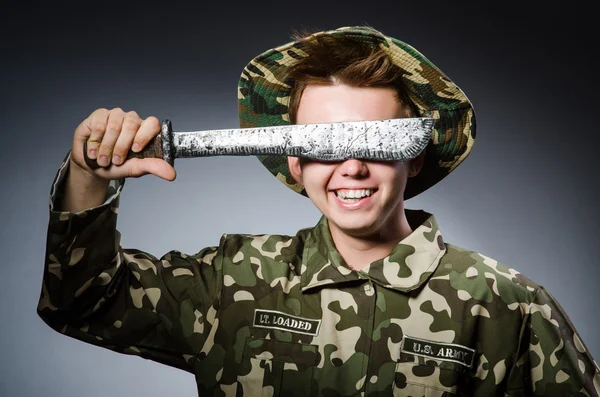 Soldier covering eyes with knife — Stock Photo, Image