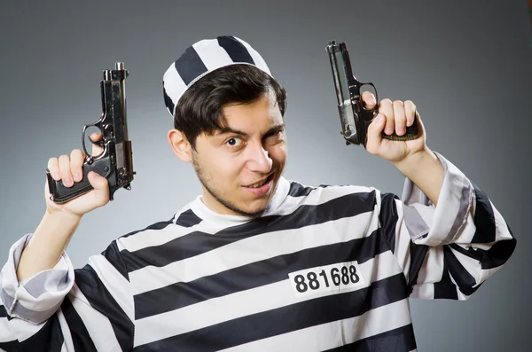 Prisoner with gun — Stock Photo, Image