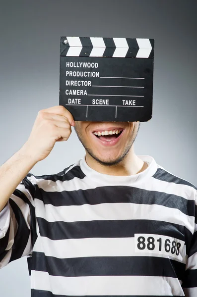 Prisoner with  movie clapper — Stock Photo, Image