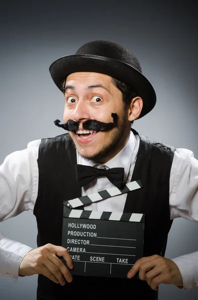 Muž s filmové klapky desky — Stock fotografie