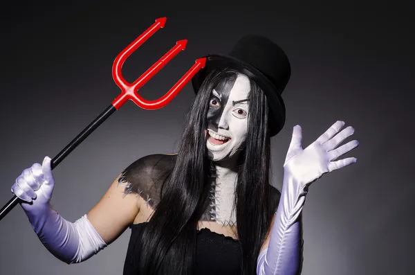 Satan woman with pitchfork and facemask — Stock Photo, Image