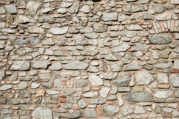 Wall made of various stones — Stock Photo, Image