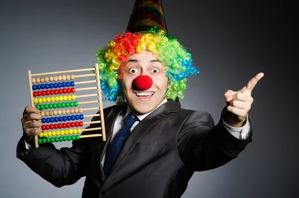 Grappige clown zakenman met abacus — Stockfoto