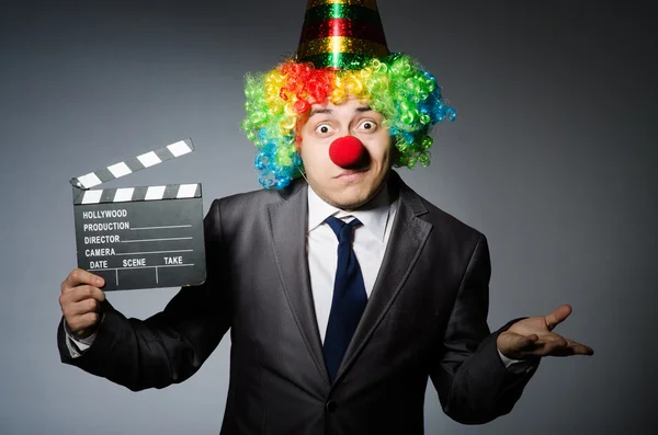 Clown with the movie board — Stock Photo, Image