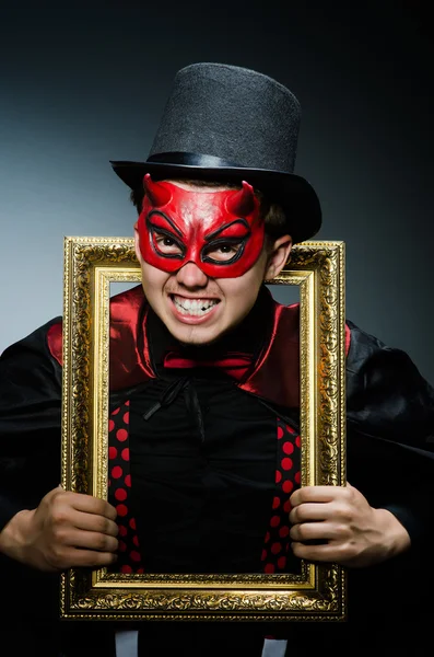 Funny devil with picture frame — Stock Photo, Image