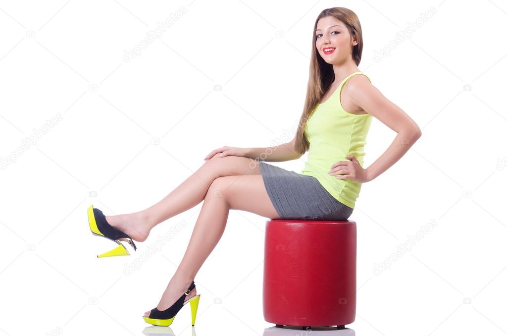 Young woman trying new shoes isolated on white