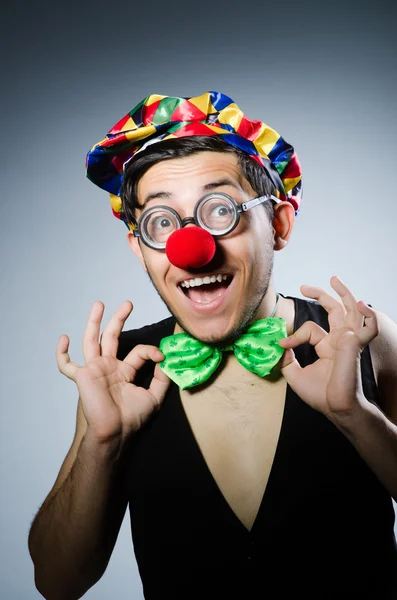 Funny clown adjusting bow — Stock Photo, Image