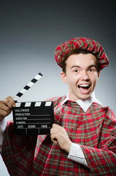 Scotsman with movie clapboard — Stock Photo, Image