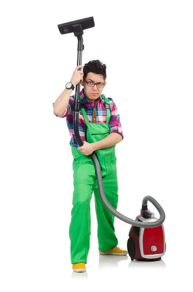 Man in het groene overall vacuüm schoonmaken — Stockfoto