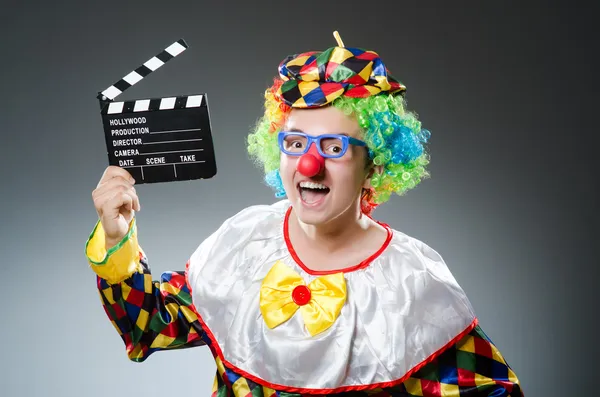 Clown with the movie board — Stock Photo, Image