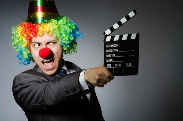 Clown with the movie board — Stock Photo, Image